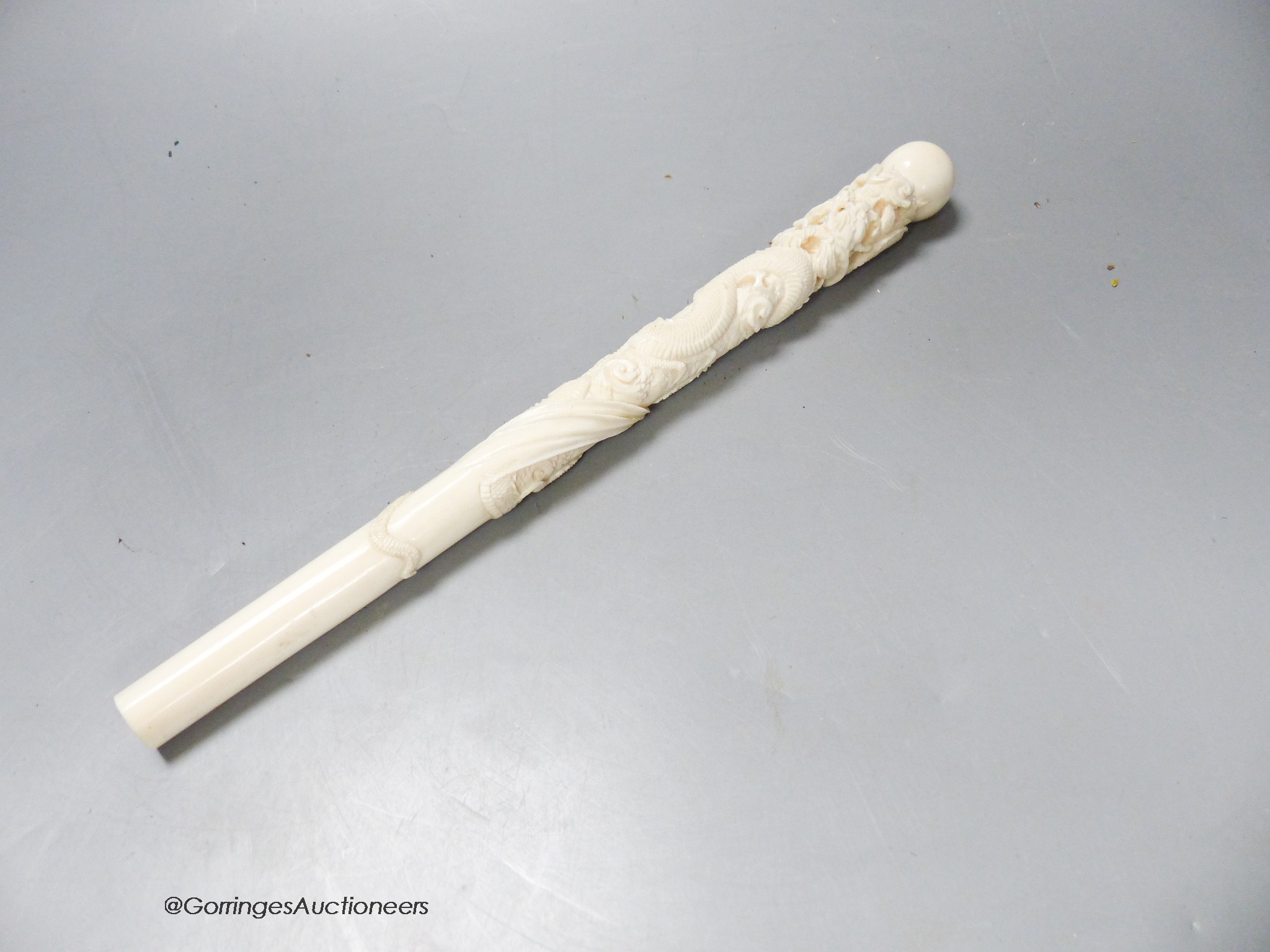A Japanese ivory 'dragon' parasol handle, early 20th century, signed